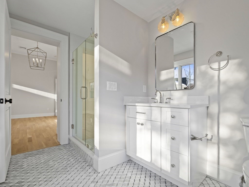 117 Abbott Road Wellesley, MA 02481 - Photo 22 of 34 a bathroom with a shower and a sink