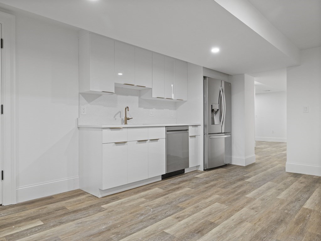 117 Abbott Road Wellesley, MA 02481 - Photo 25 of 34 a kitchen with a refrigerator sink and cabinets
