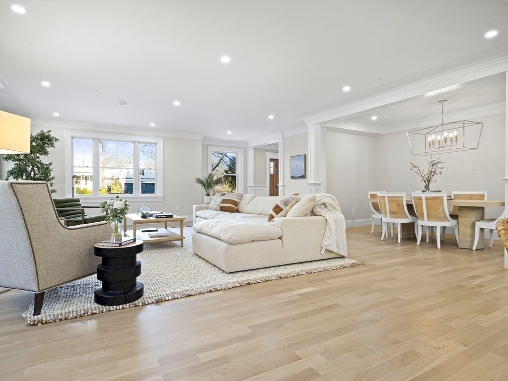 117 Abbott Road Wellesley, MA 02481 - Photo 3 of 34 a living room with lots of furniture and a dining table with kitchen view