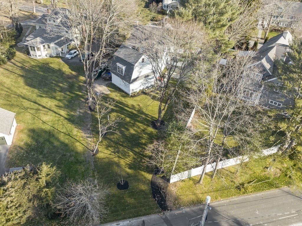 117 Abbott Road Wellesley, MA 02481 - Photo 33 of 34 a backyard of a house with a yard and large trees