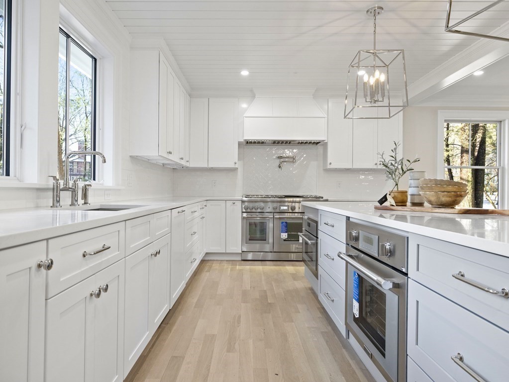 117 Abbott Road Wellesley, MA 02481 - Photo 8 of 34 a kitchen with cabinets a sink and appliances