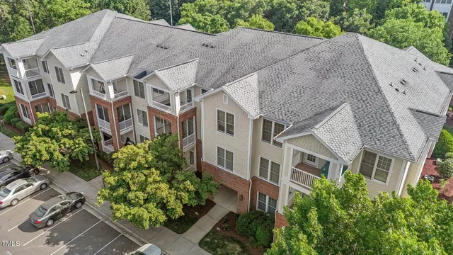 a aerial view of a house with plants and trees