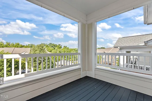 an aerial view of a house with a yard and lake view
