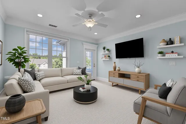 a living room with furniture and a flat screen tv