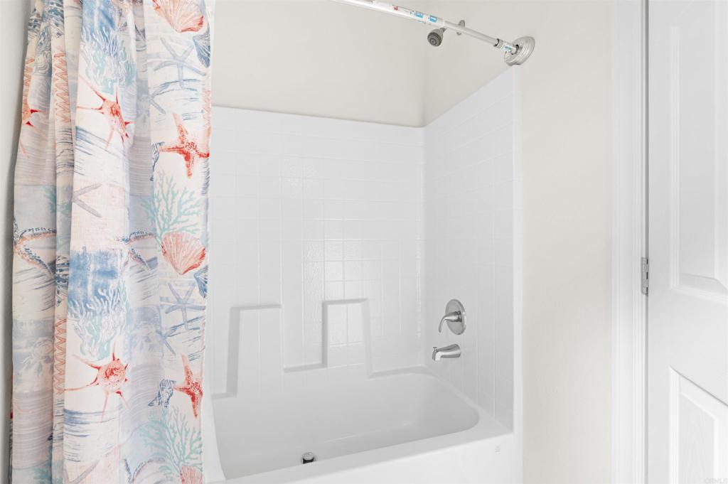 8545 Mission Gorge Road, Unit 253A Santee, CA 92071 - Photo 16 of 21 a bathroom with a bathtub and shower