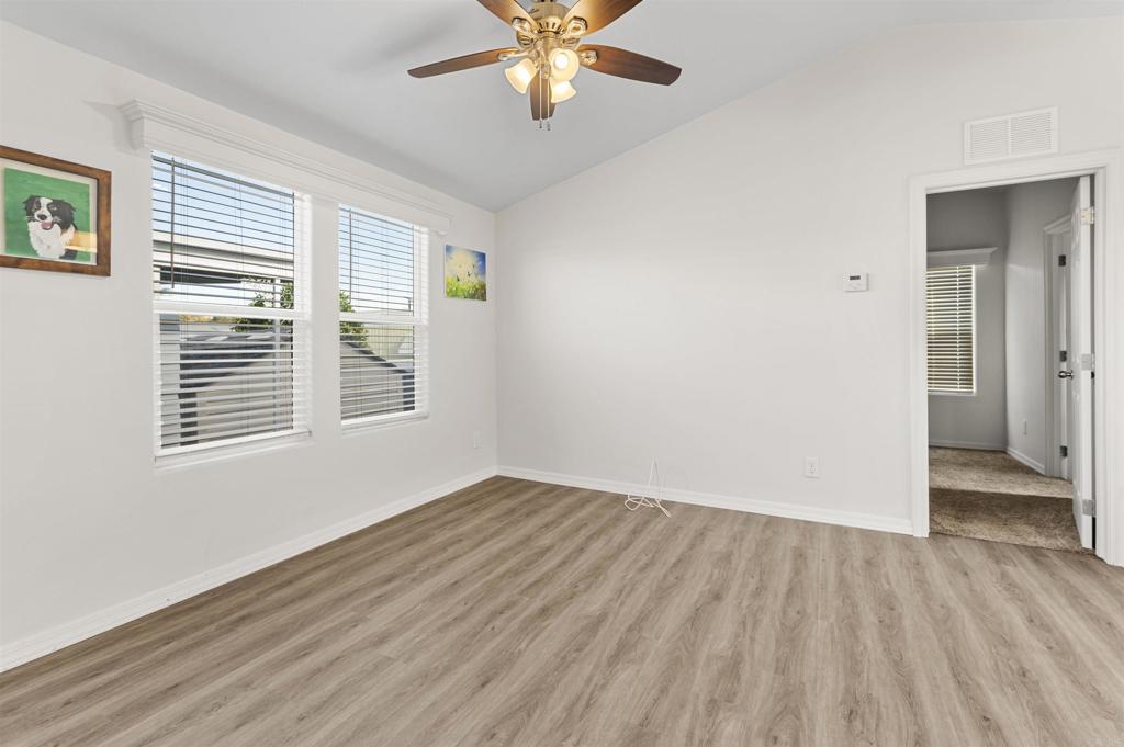 8545 Mission Gorge Road, Unit 253A Santee, CA 92071 - Photo 7 of 21 a view of an empty room with wooden floor and a window