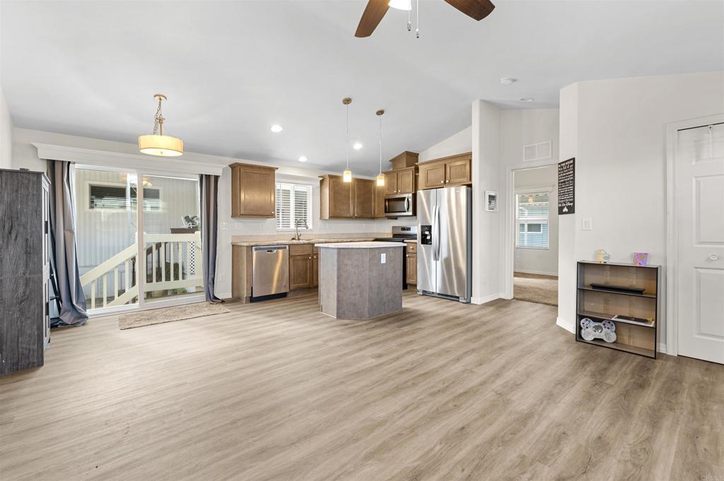 8545 Mission Gorge Road, Unit 253A Santee, CA 92071 - Photo 8 of 21 a large kitchen with cabinets and stainless steel appliances
