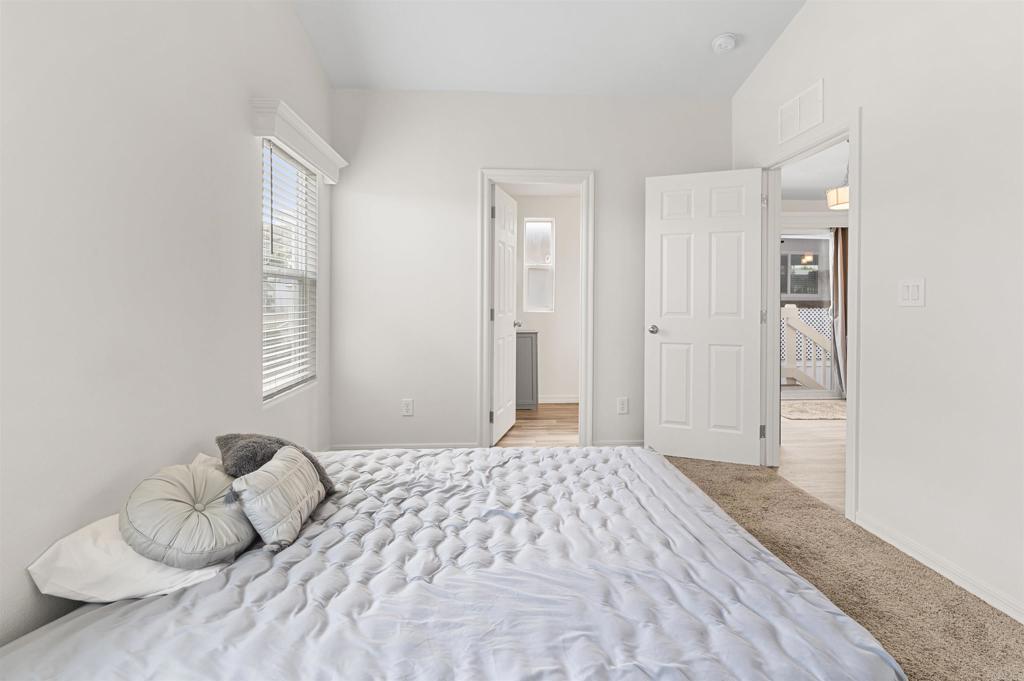 8545 Mission Gorge Road, Unit 253A Santee, CA 92071 - Photo 10 of 21 a bedroom with a bed and window