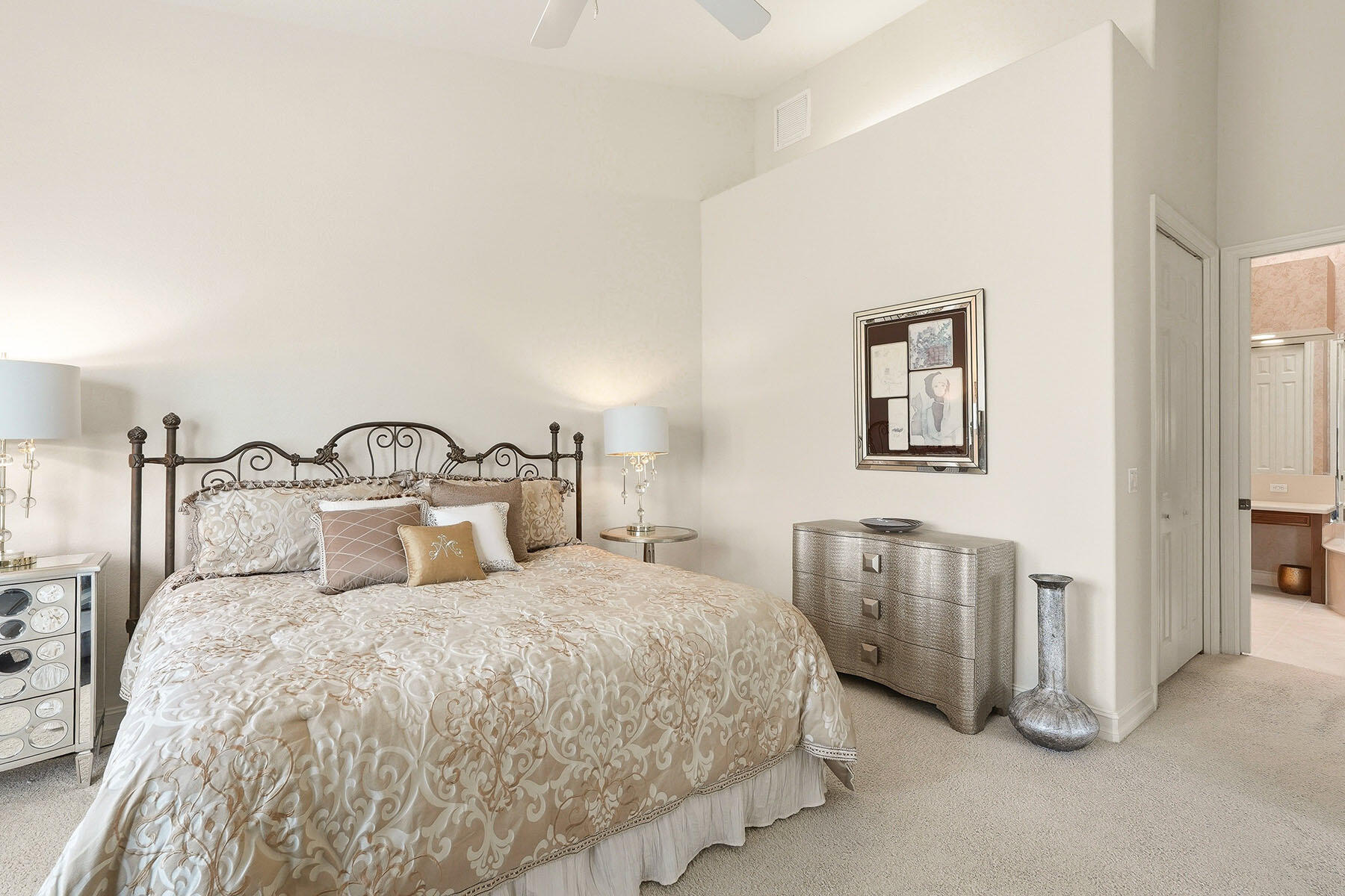 8605 Champions Point, Unit 103 Naples, FL 34113 - Photo 24 of 44 a bedroom with double bed and a night stand
