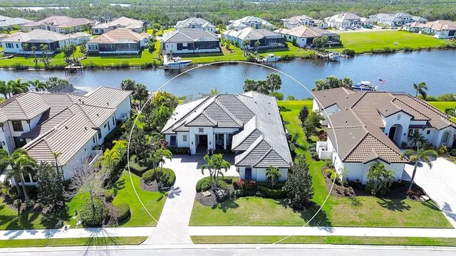 an aerial view of house with yard swimming pool and outdoor seating