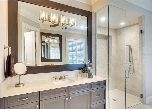 a bathroom with double vanity sinks and a mirror