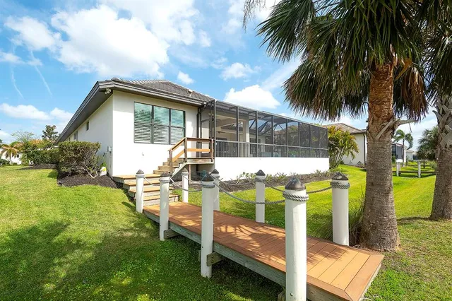 a front view of house with yard having patio