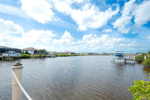 a view of a lake with outdoor seating space and lake view
