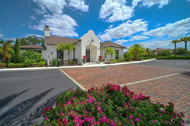 a view of a multi story building with a yard