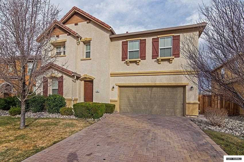 a front view of a house with yard