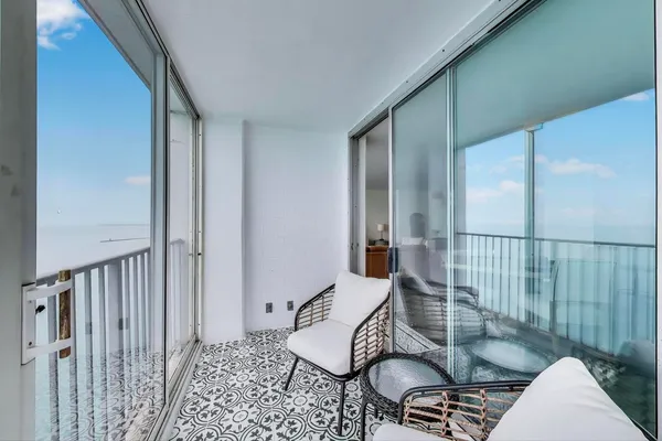 a view of a bunch of flowers in a balcony