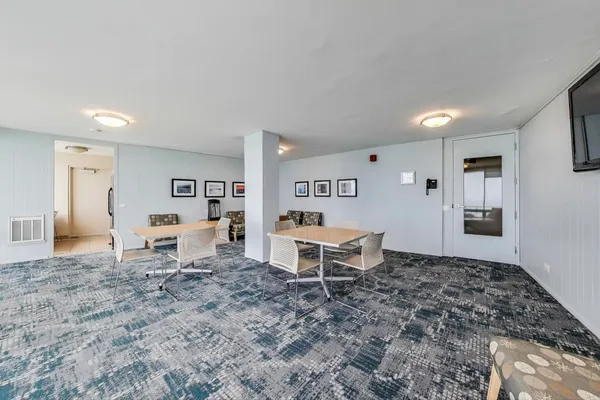 a kitchen with stainless steel appliances a refrigerator and a stove top oven