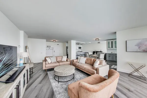 a living room with furniture and a stove