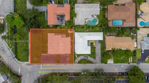 an aerial view of a house with outdoor space