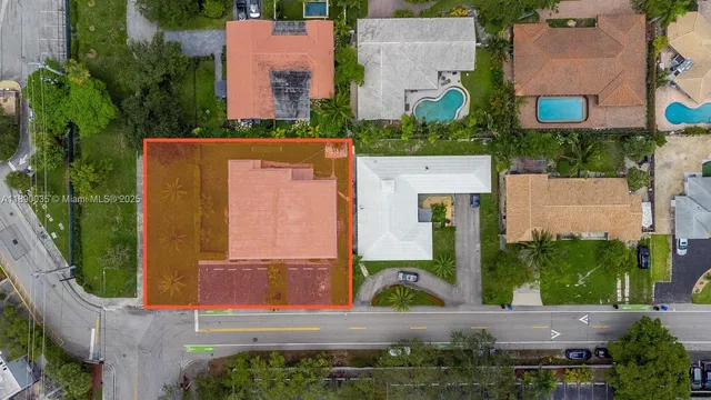 an aerial view of a house with outdoor space