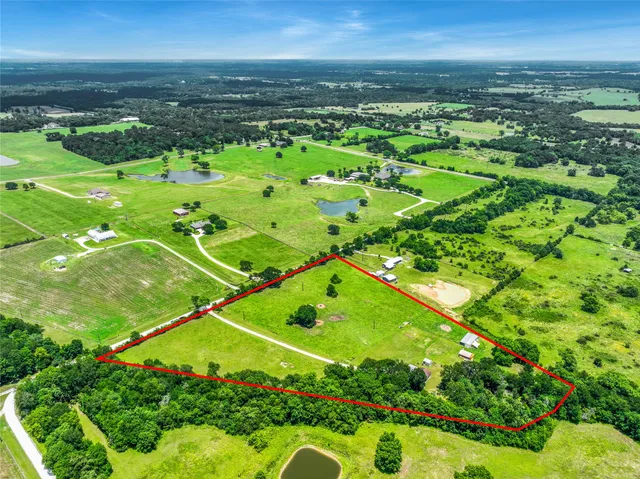 a view of a field with an ocean