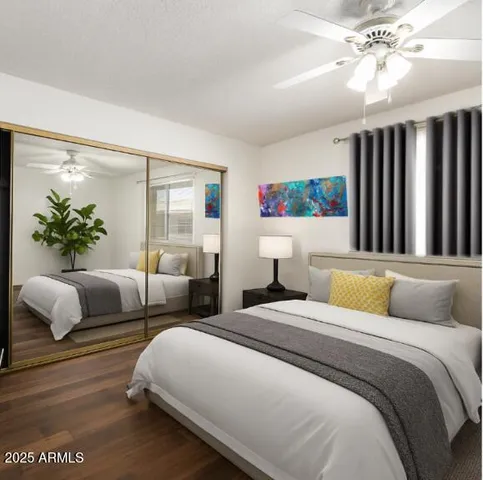 a bedroom with a large bed and a couch