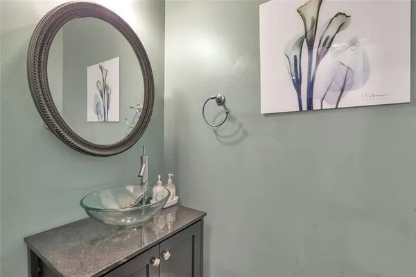 a bathroom with a mirror and a sink