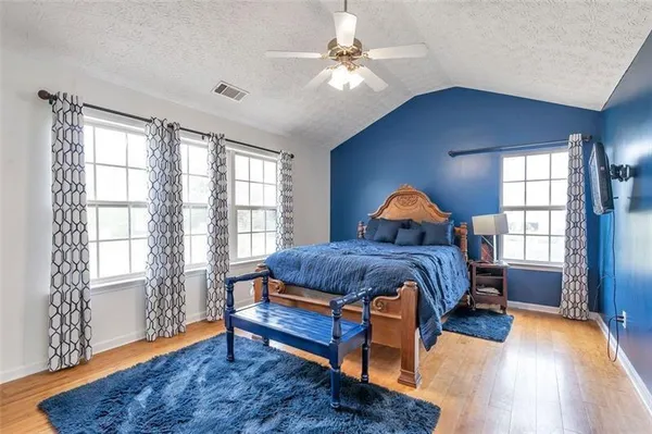 a bedroom with a bed and window