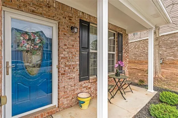 a view of a entryway door and dining room