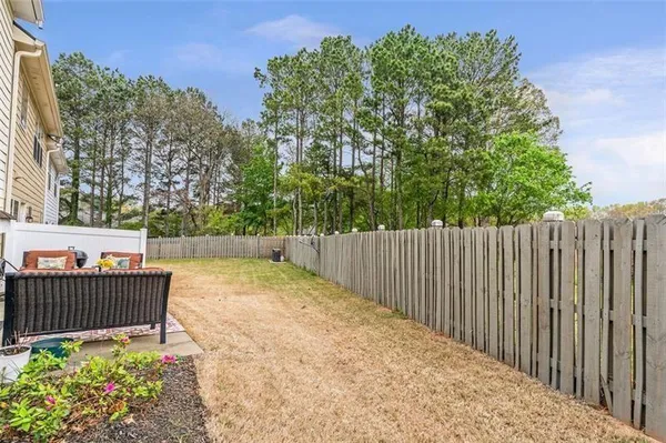 a backyard of a house with outdoor seating