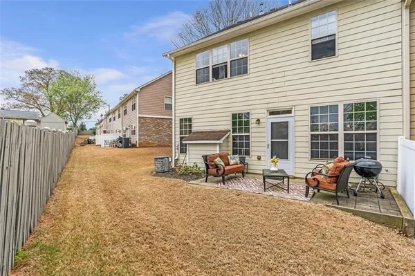 a view of a patio with a table and chairs