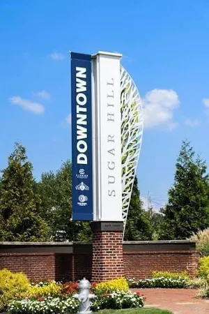 a view of a swimming pool with outdoor seating