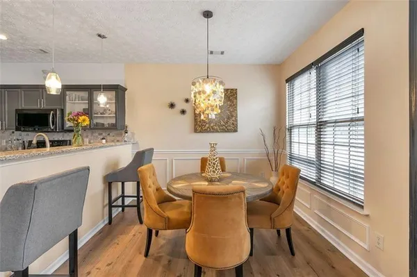 a dining room with furniture and window