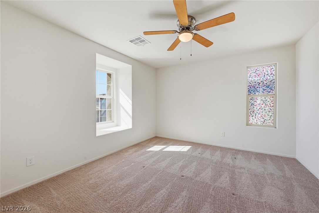 250 Dedication Avenue Henderson, NV 89011 - Photo 36 of 67 Carpeted empty room featuring a ceiling fan and baseboards