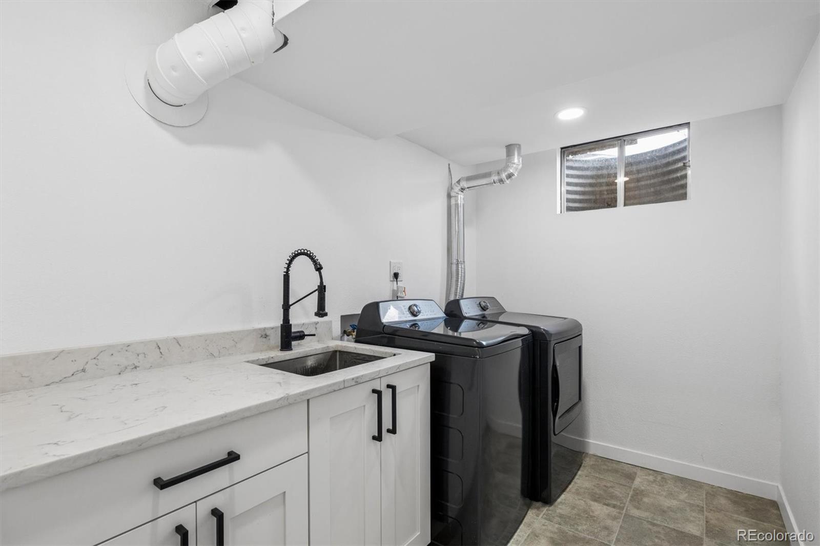 8257 Yarrow Court Arvada, CO 80005 - Photo 34 of 38 a close view of sink and tap