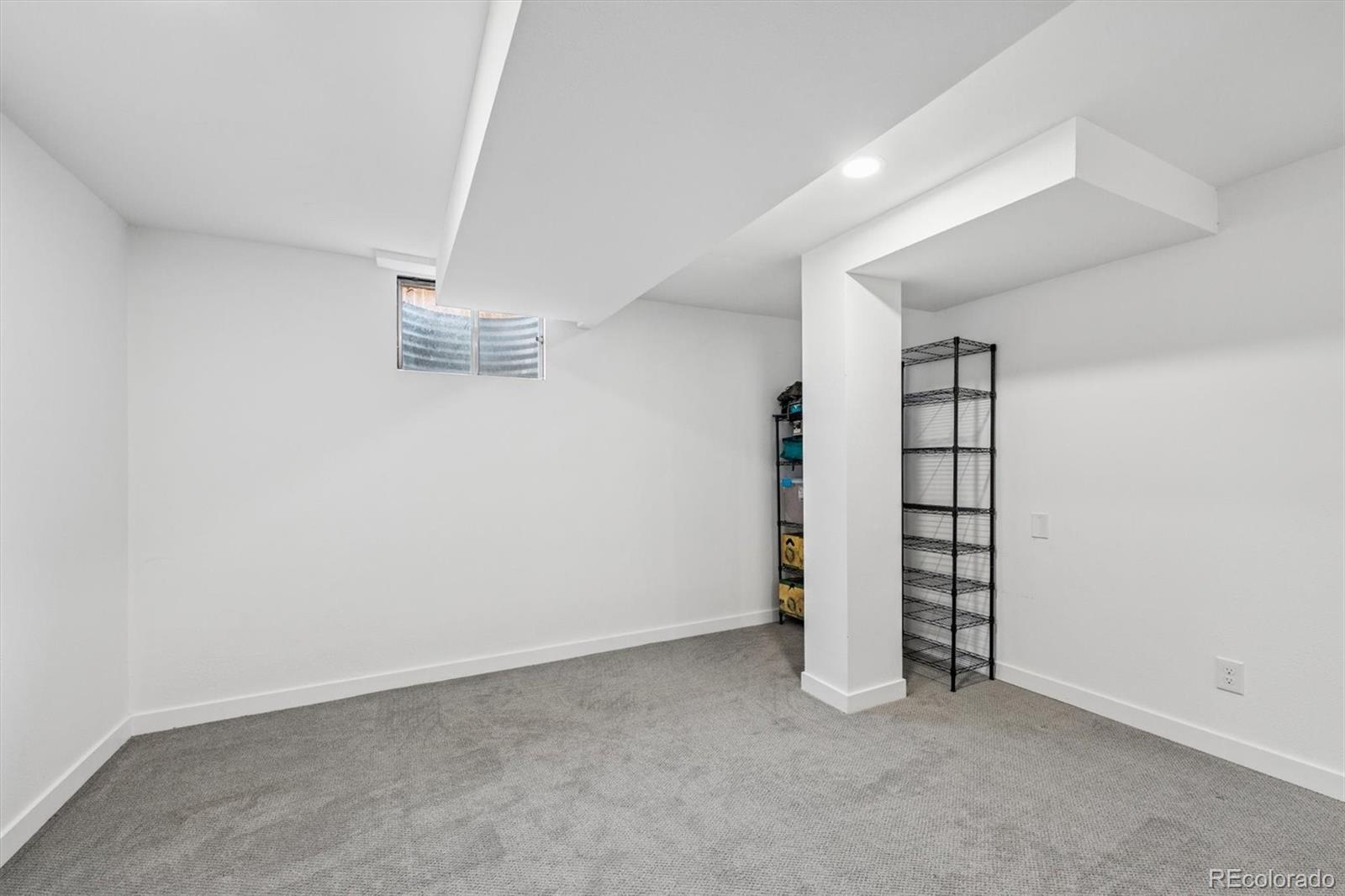 8257 Yarrow Court Arvada, CO 80005 - Photo 35 of 38 an empty room with windows