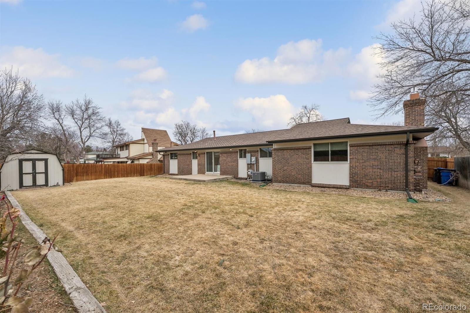 8257 Yarrow Court Arvada, CO 80005 - Photo 37 of 38 a house with yard in front of it