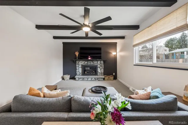 a living room with furniture and a fireplace