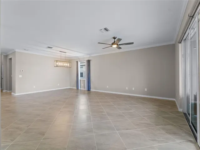 a kitchen with granite countertop a sink stove and microwave