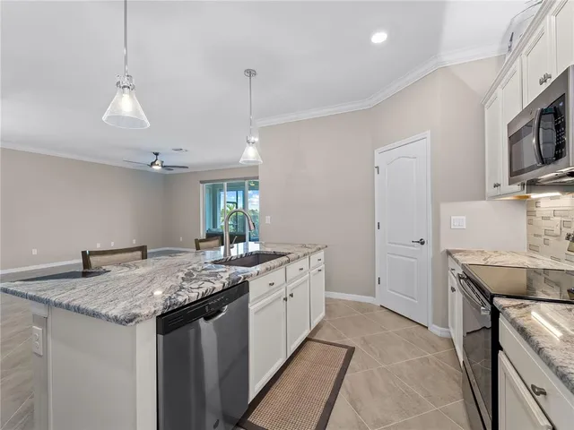 a bedroom with a large bed and a flat screen tv