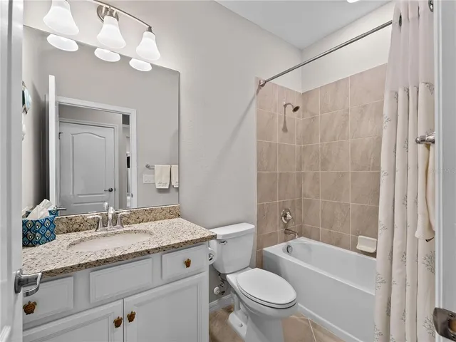 a view of a hallway with wooden shelves