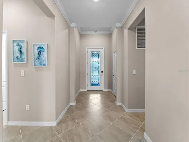 a view of front door of house with potted plant