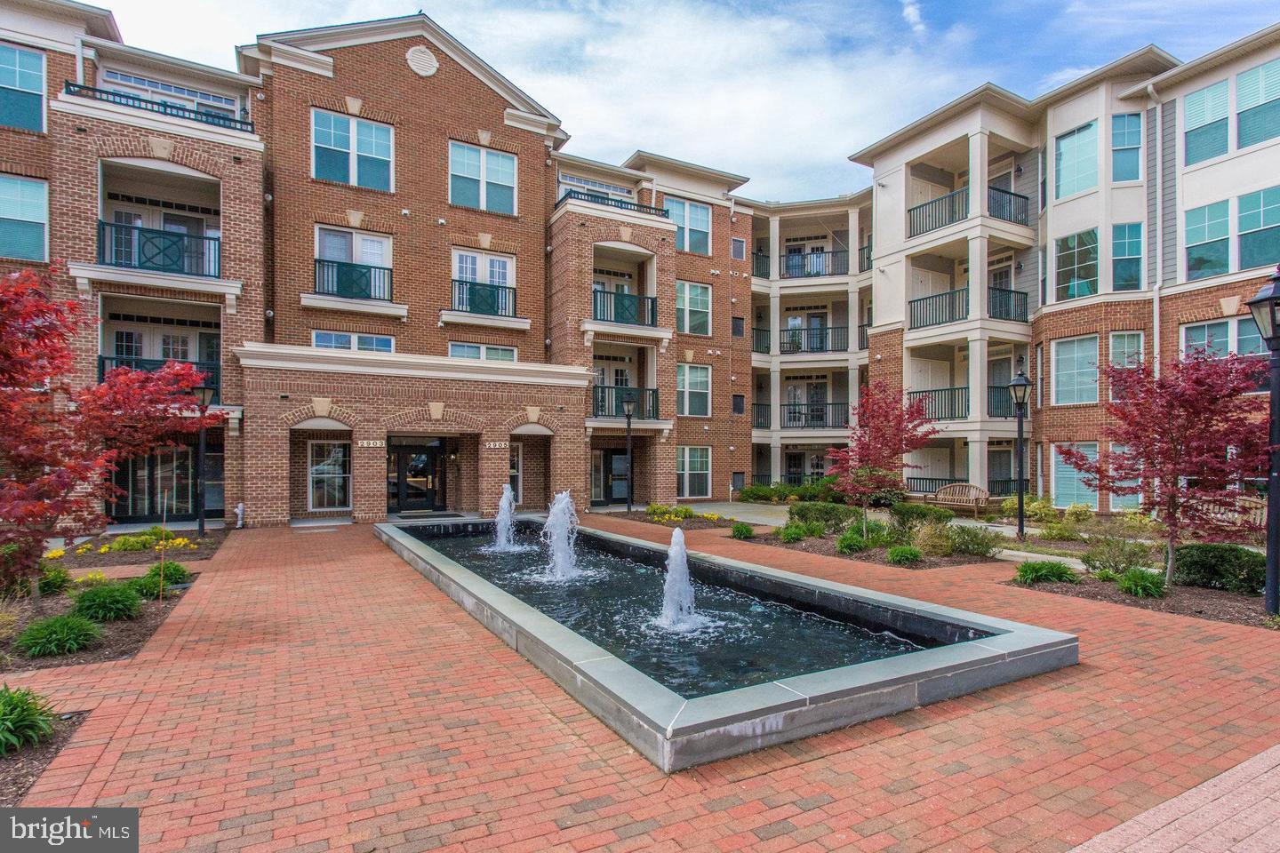 2903 Saintsbury Plaza, Unit 203 Fairfax, VA 22031 - Photo 1 of 33 a front view of building with yard