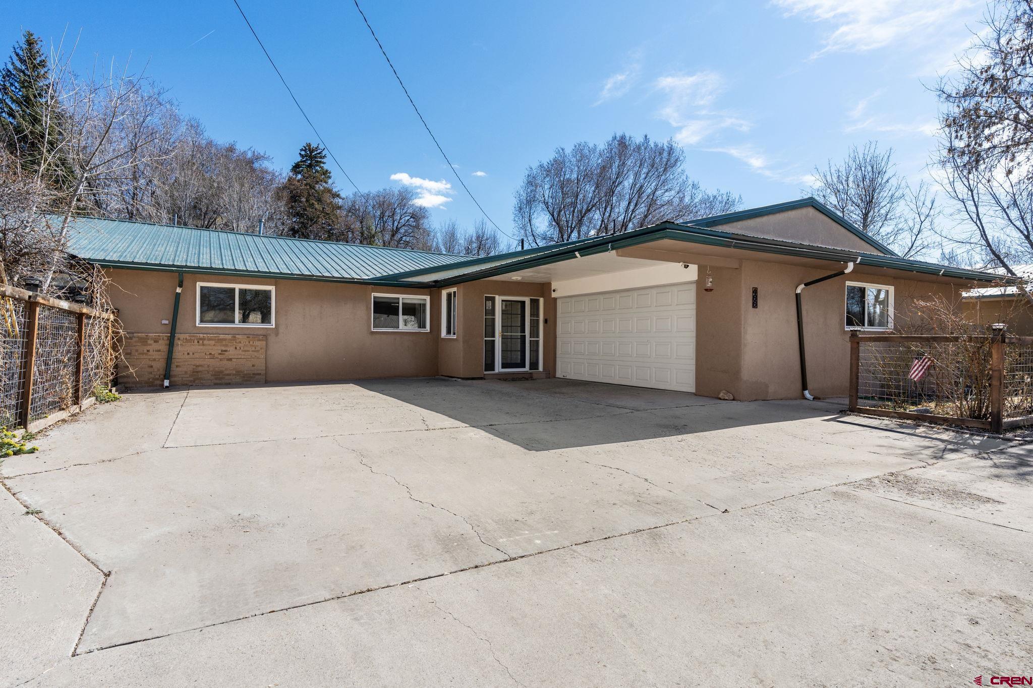 486 South Church Street Bayfield, CO 81122 - Photo 1 of 32 a view of house with backyard and trees in the background