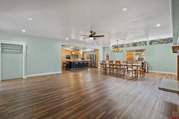 a view of a room with wooden floor
