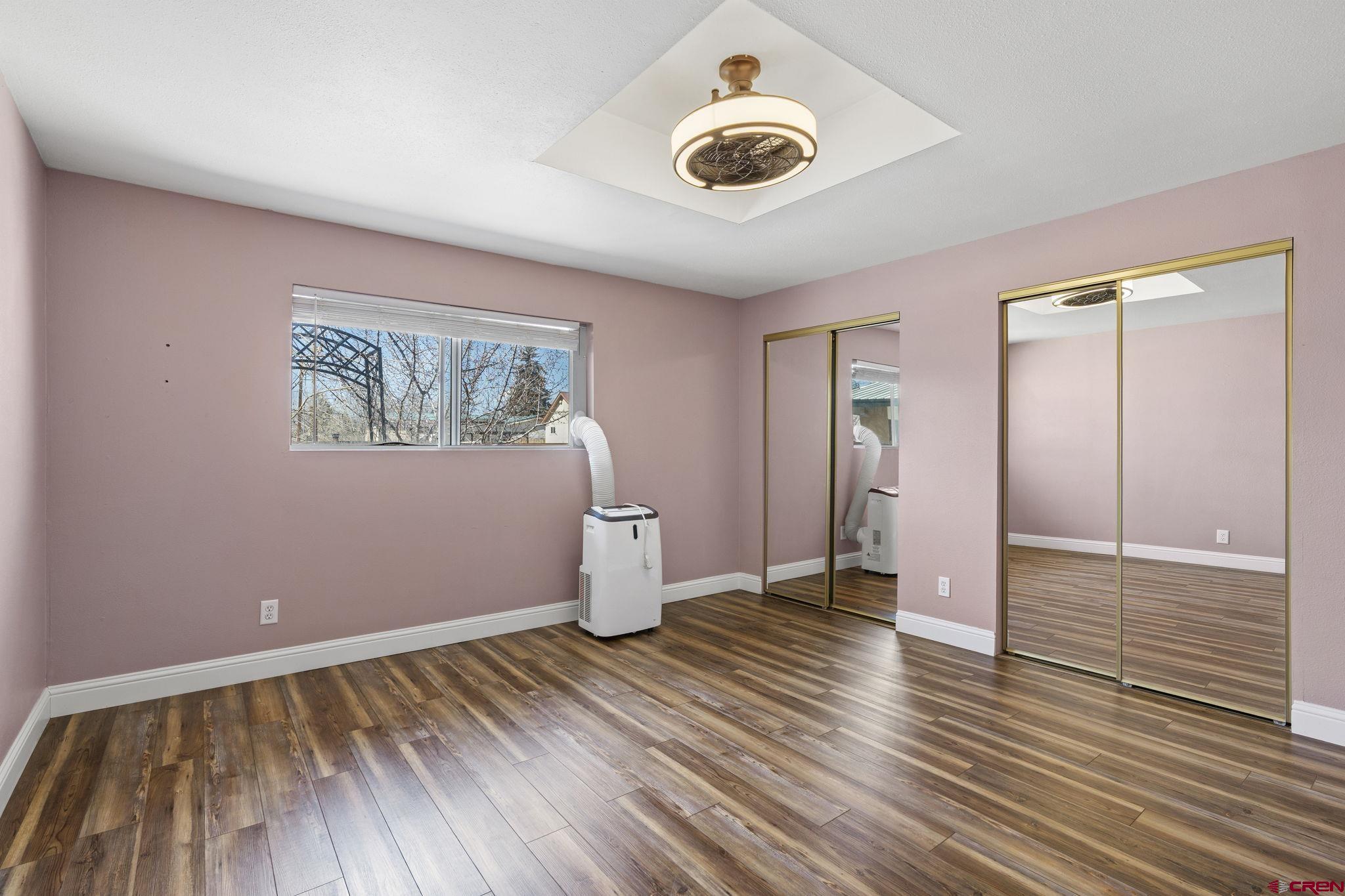 486 South Church Street Bayfield, CO 81122 - Photo 18 of 32 an empty room with wooden floor and closet