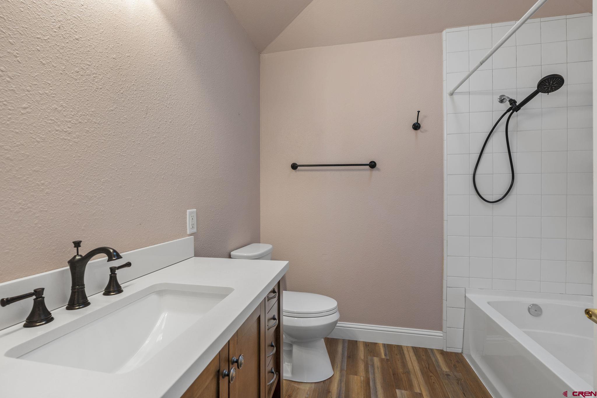 486 South Church Street Bayfield, CO 81122 - Photo 19 of 32 a bathroom with a sink a toilet and shower