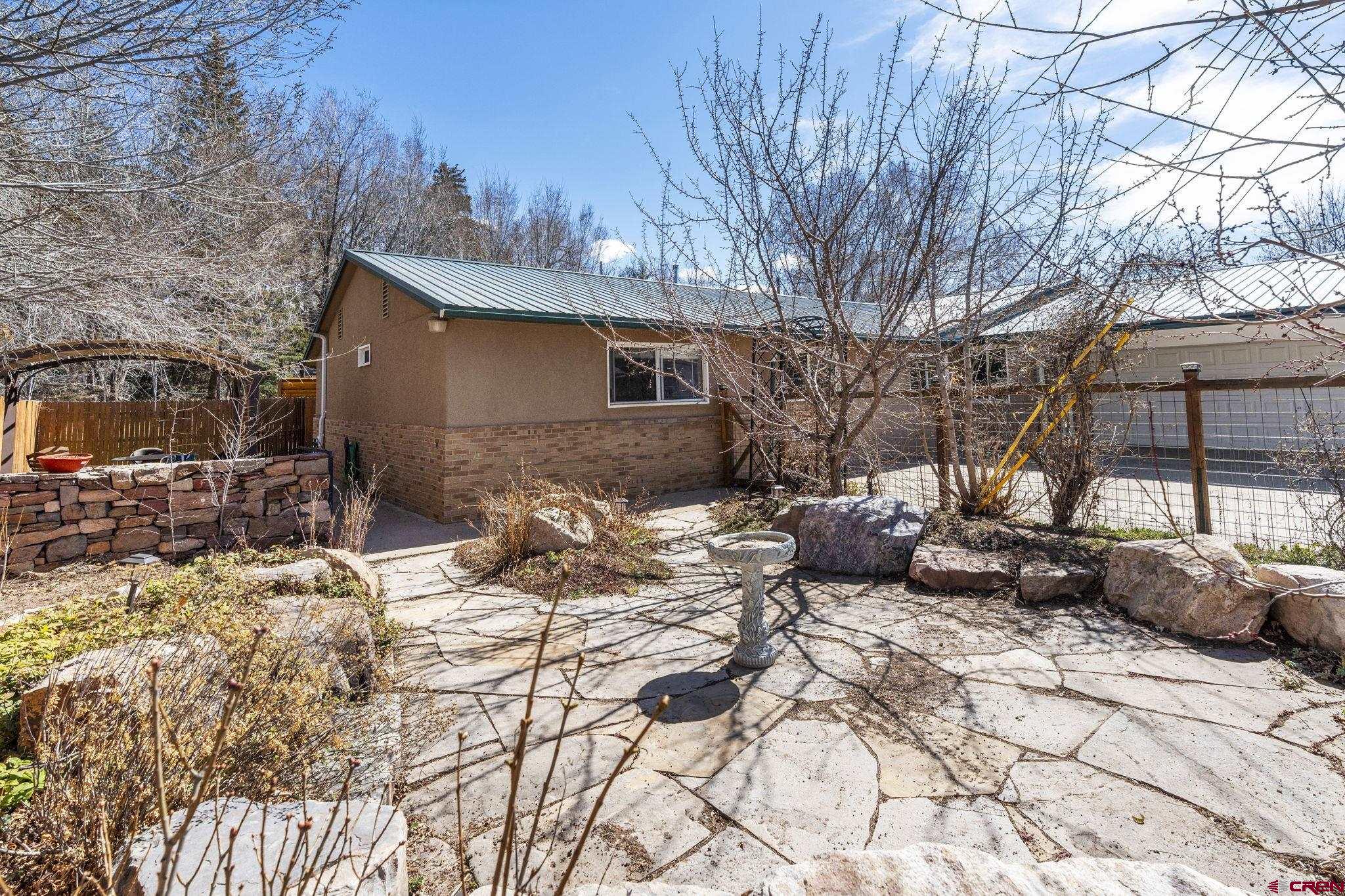 486 South Church Street Bayfield, CO 81122 - Photo 2 of 32 a view of a chairs and tables in the back yard of the house