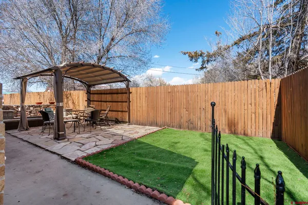 a view of backyard with sitting area