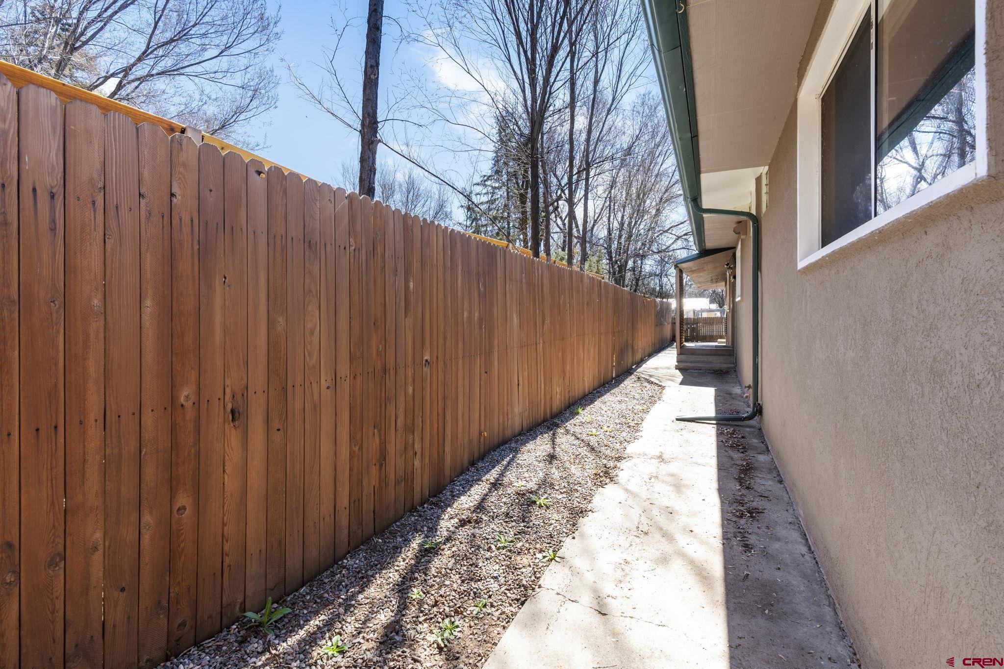 486 South Church Street Bayfield, CO 81122 - Photo 31 of 32 a view of a pathway with a wooden fence